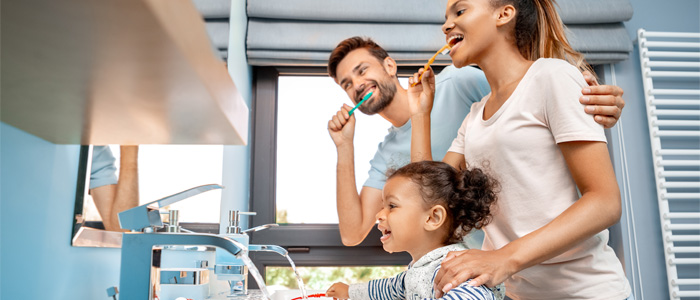 Family brushing teeth